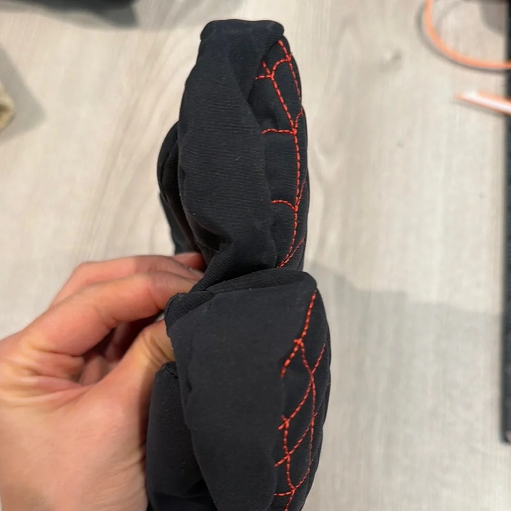 Kids Spyder Black Mittens with Red Web Design is size Medium